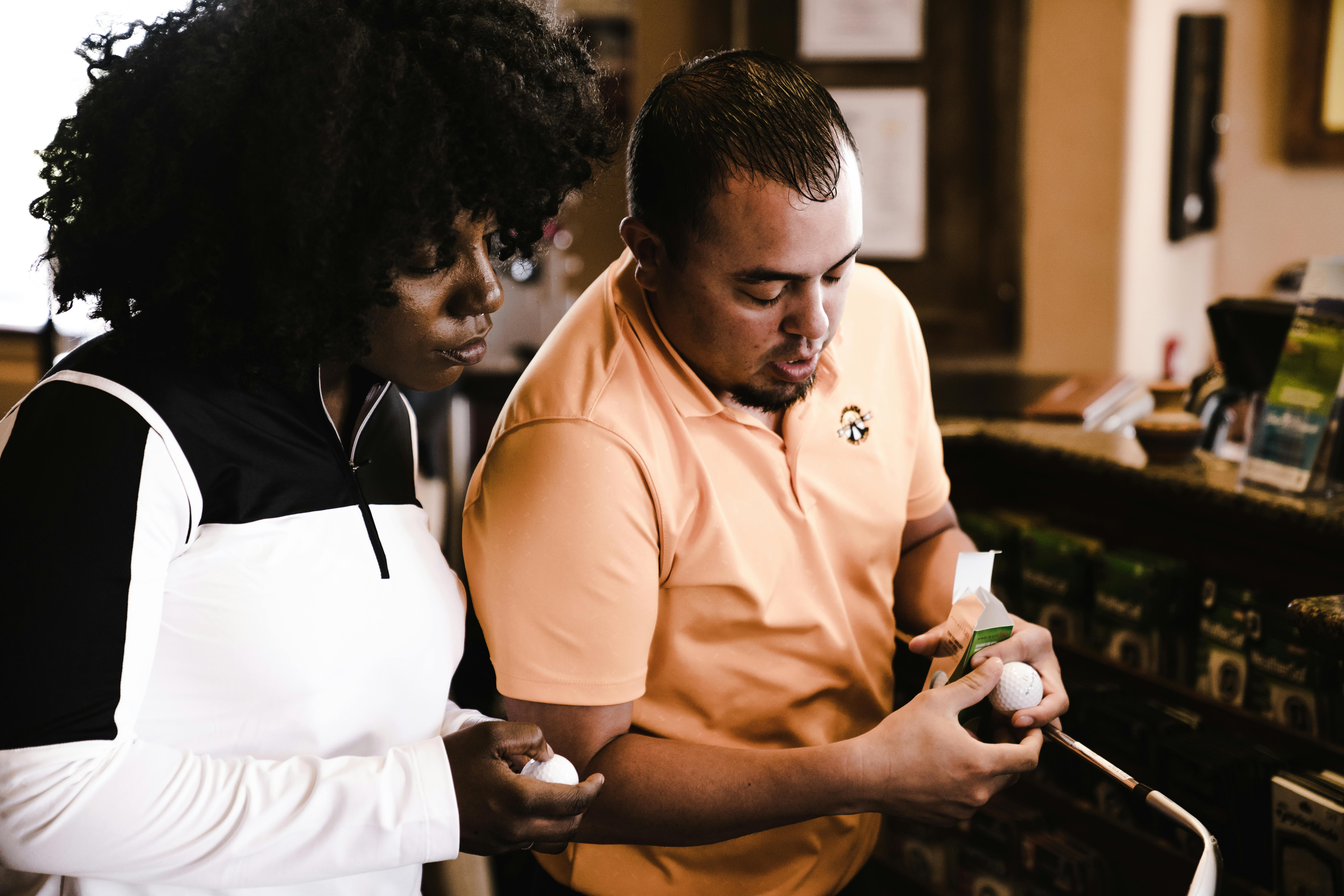 man looking at golf club