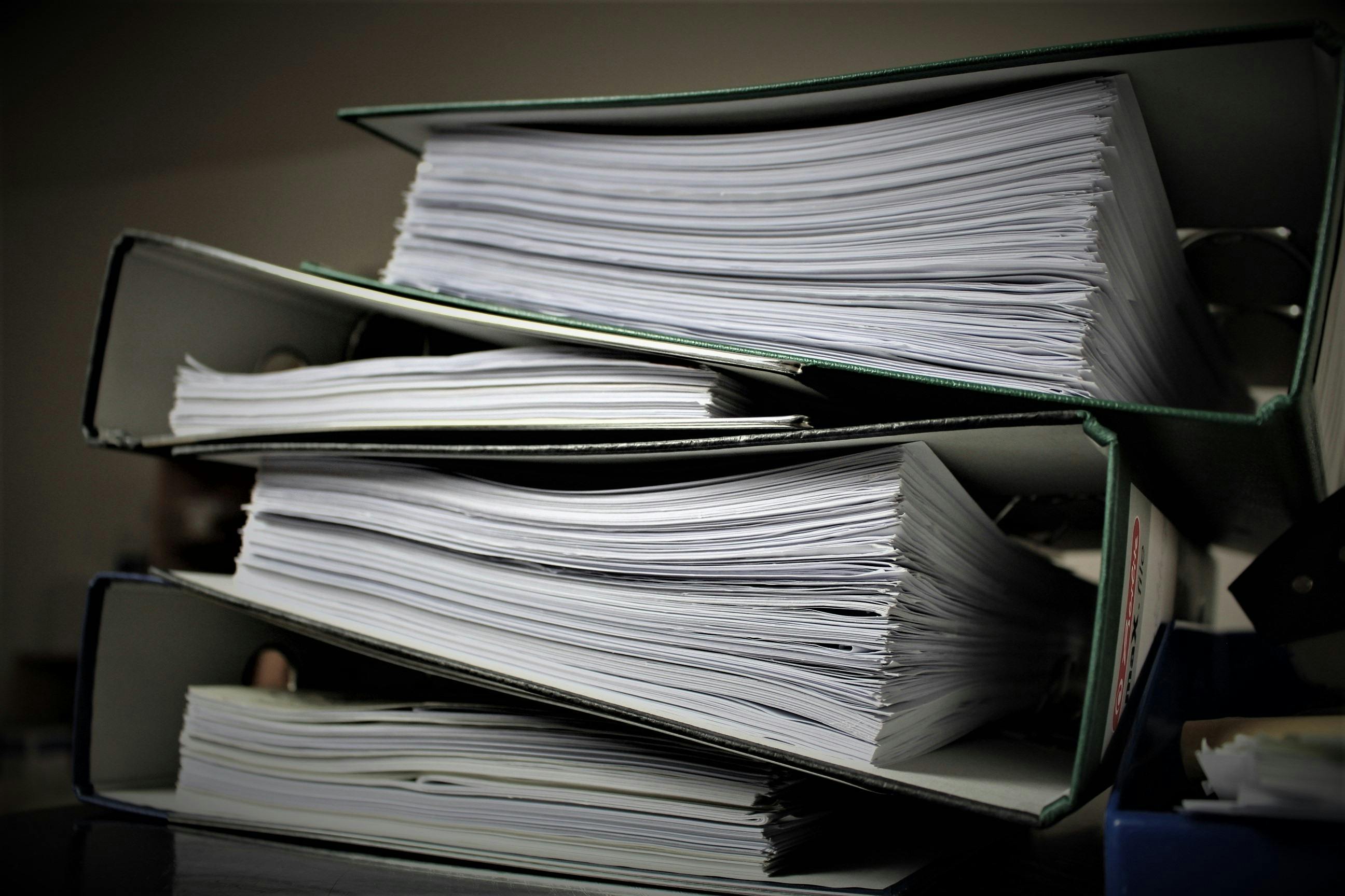 Stack of filled document binders
