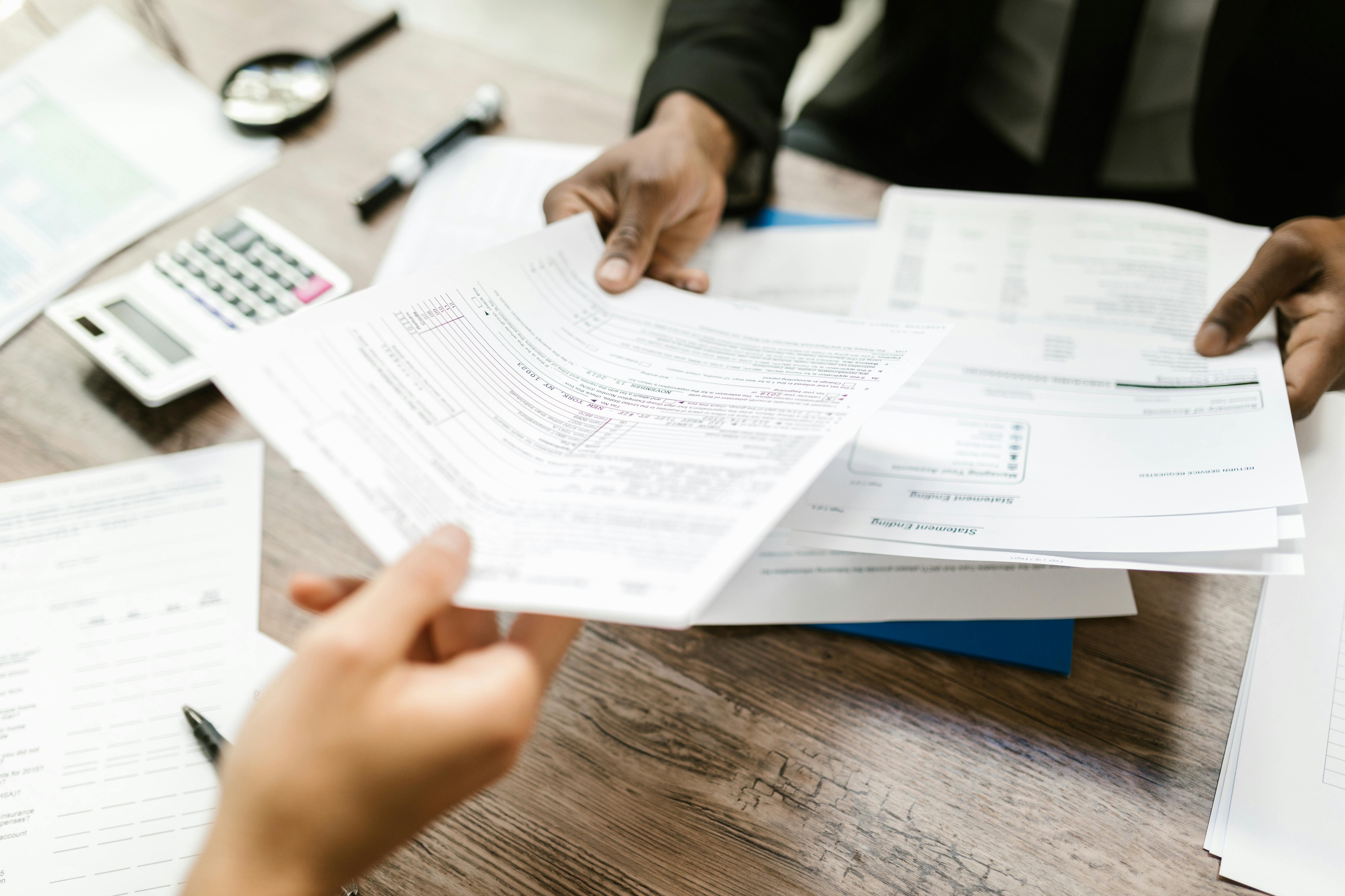 tax forms being handed to someone
