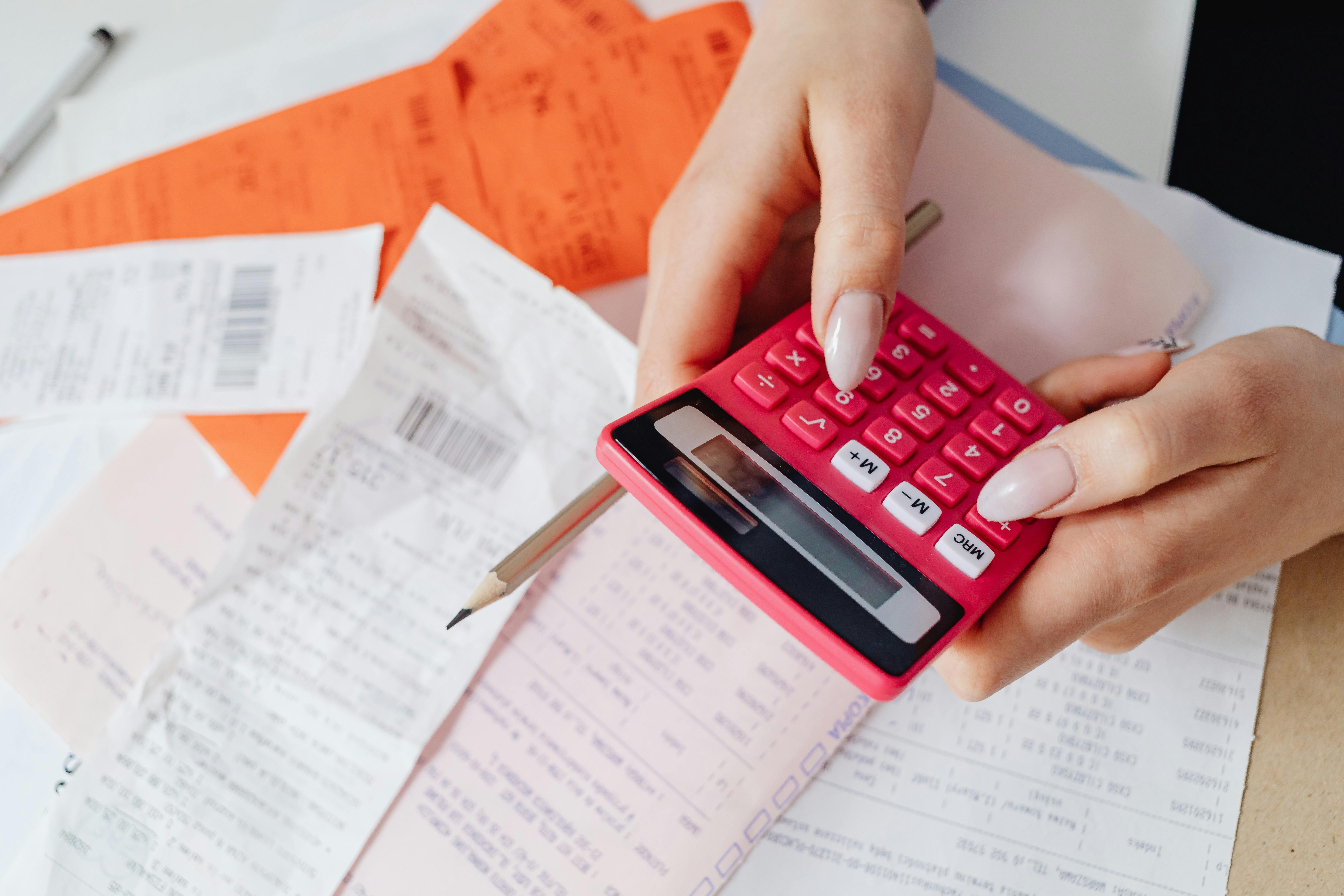 Calculator with papers below