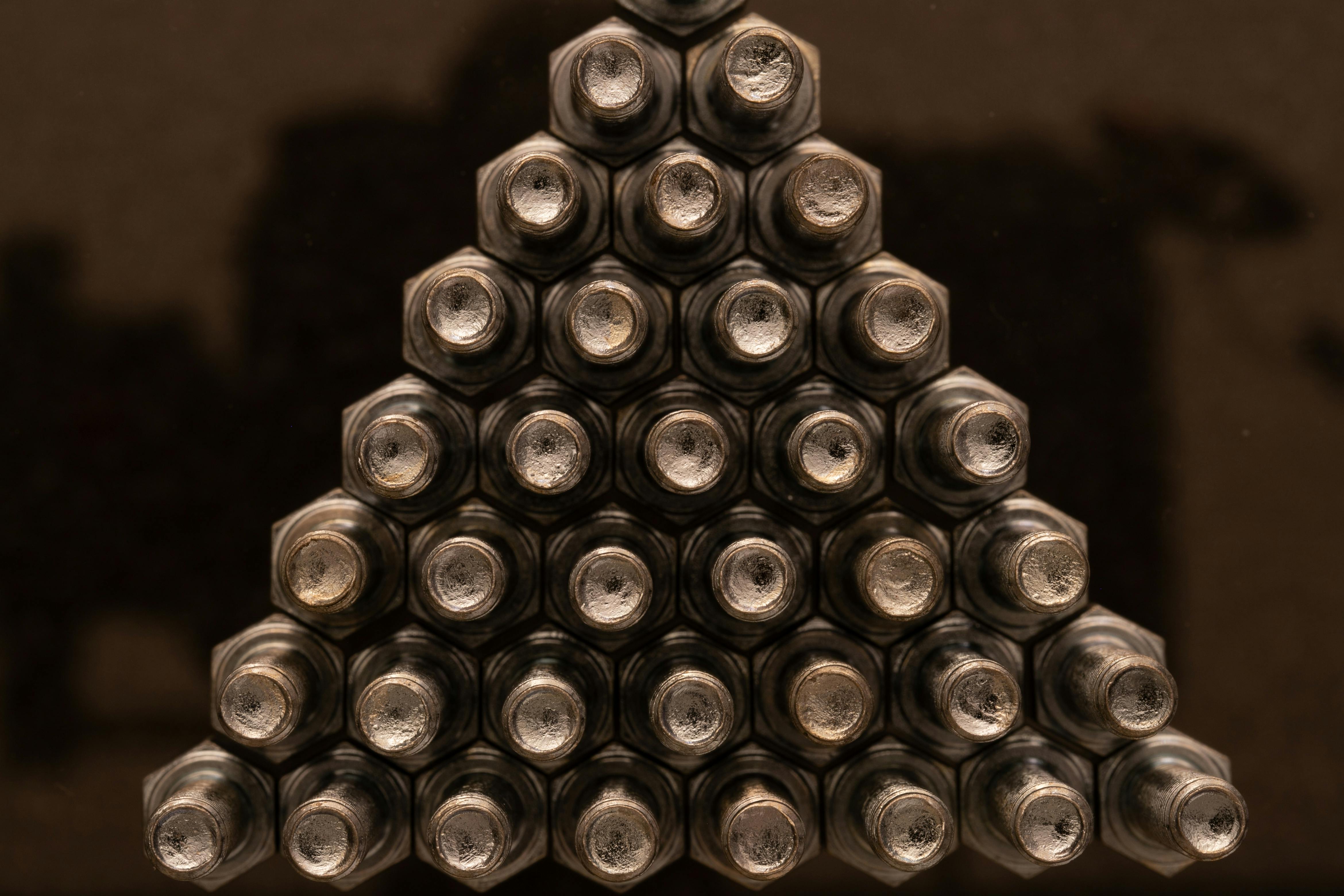 iron screws in a pyramid