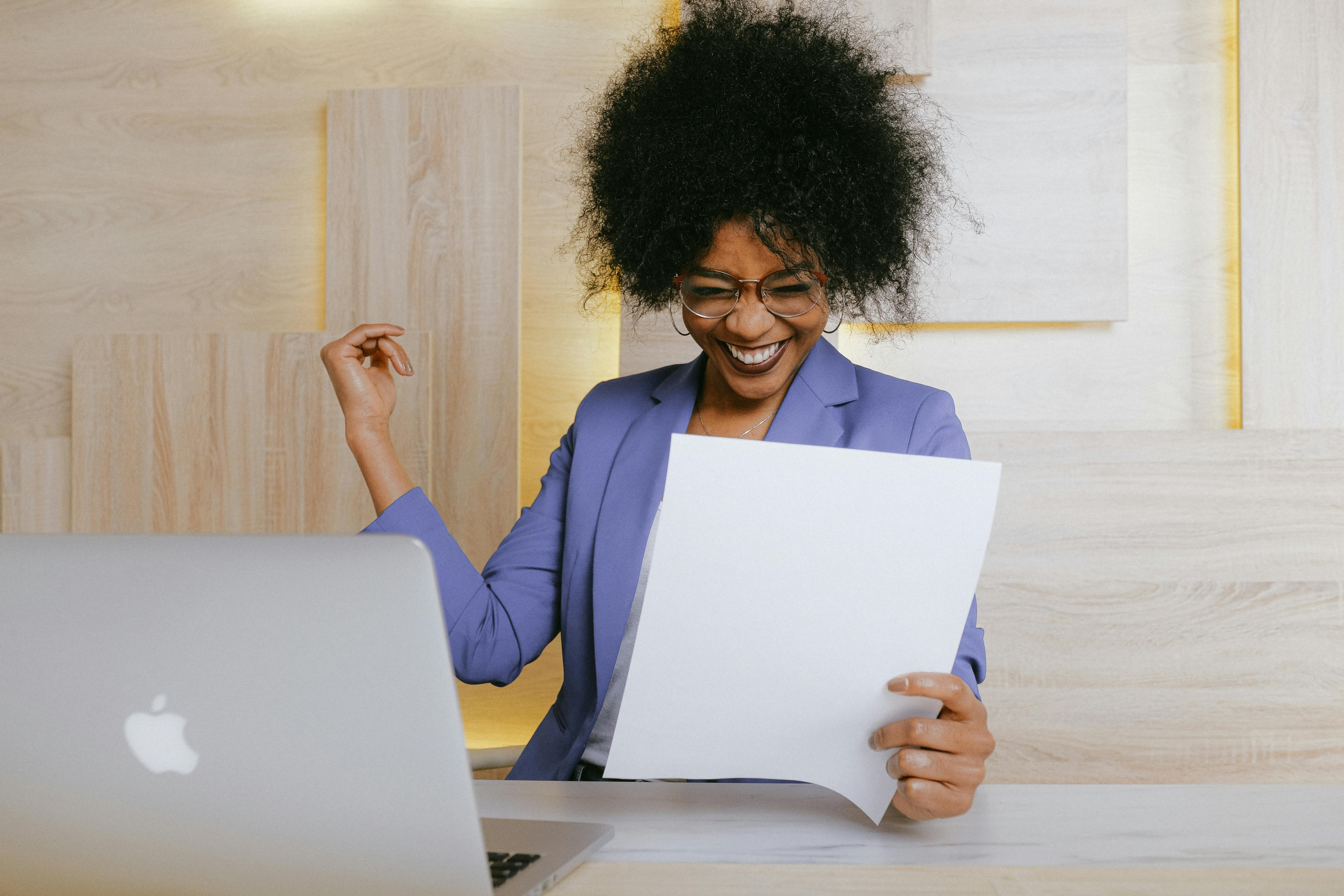 Person reviewing documents at desk