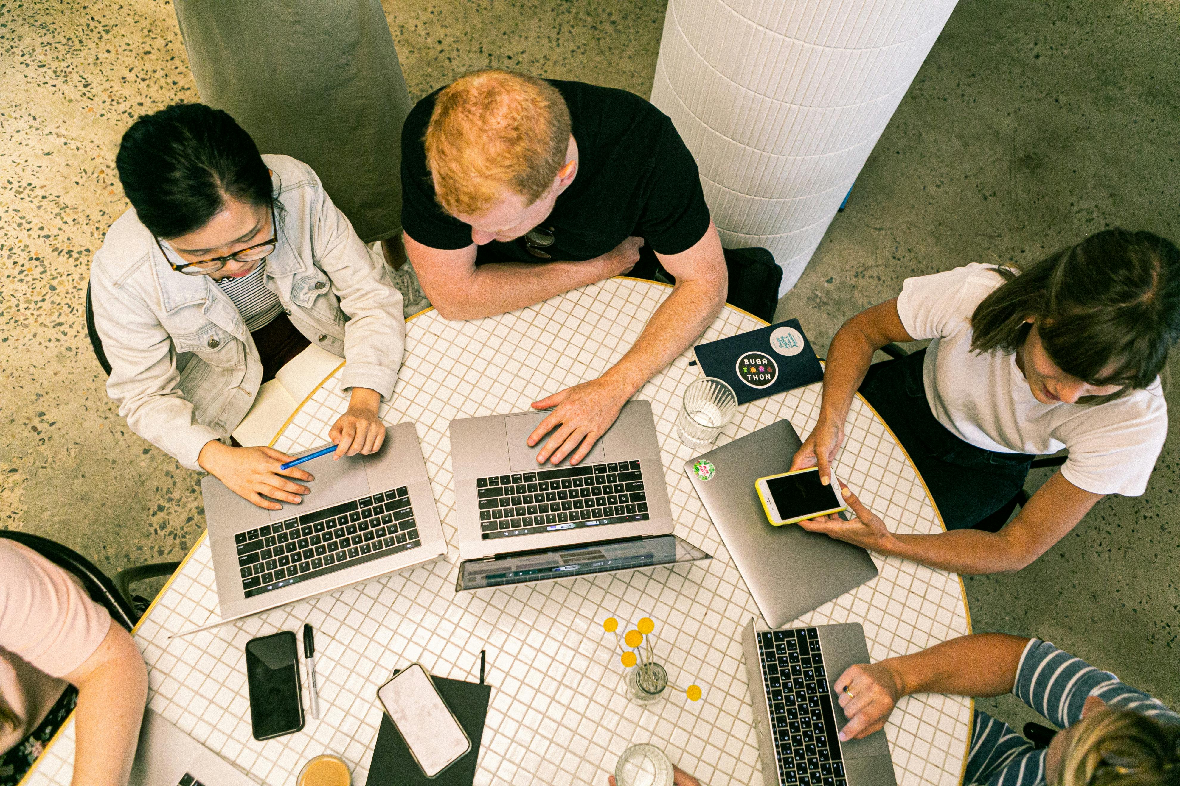 Group working on laptops together
